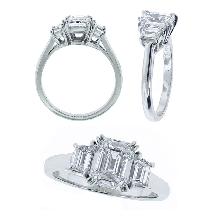 Platinum emerald cut diamond ring.